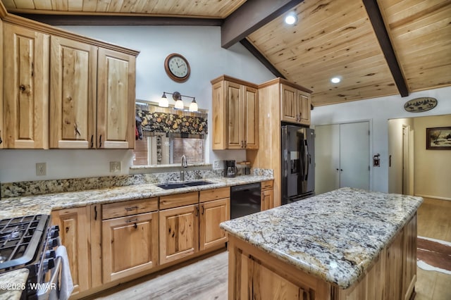 kitchen featuring light wood-style flooring, a kitchen island, vaulted ceiling with beams, black appliances, and a sink