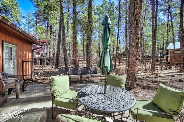 view of patio / terrace featuring fence and outdoor lounge area