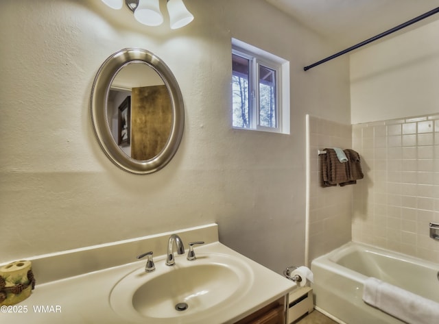 bathroom with baseboard heating, a sink, and shower / tub combination