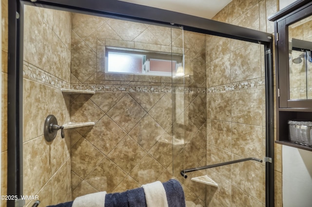 full bath featuring tiled shower