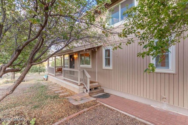 property entrance with covered porch