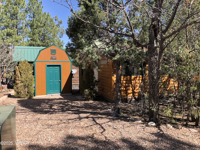 view of shed with fence