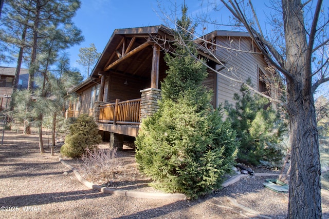 view of property exterior featuring a deck