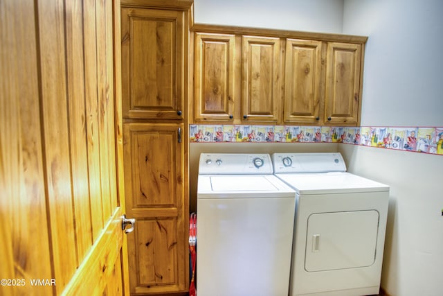 washroom with cabinet space and washing machine and dryer