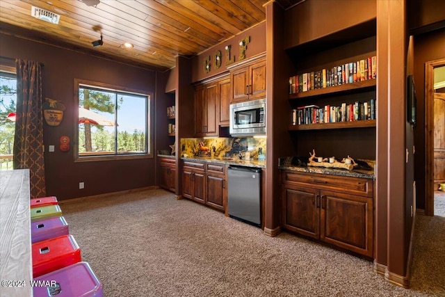 kitchen with light colored carpet, wood ceiling, stainless steel microwave, and dishwasher