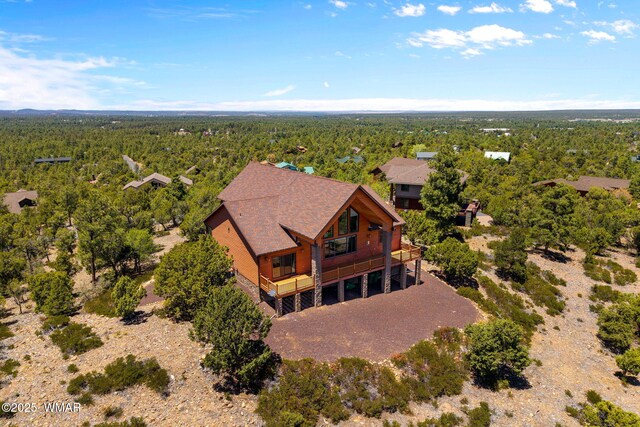 1561 S Canyon Ridge Trl, Show Low, AZ 85901 - aerial view of property and surrounding area with a heavily wooded area