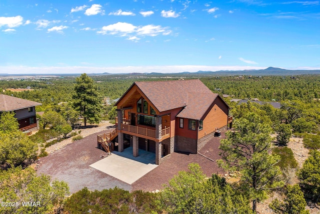 1561 S Canyon Ridge Trl, Show Low, AZ 85901 - view from above of property with a mountain backdrop and a forest