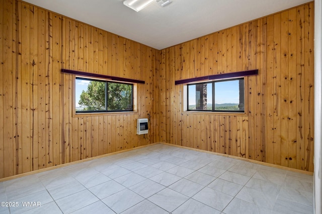 1561 S Canyon Ridge Trl, Show Low, AZ 85901 - spare room featuring heating unit and wood walls