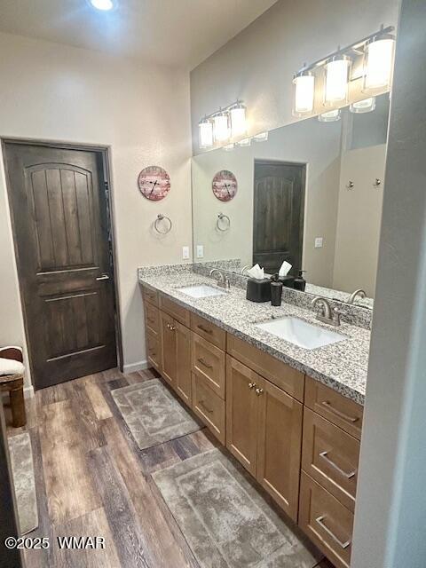 3180 N Eagles Creek Dr, Show Low, AZ 85901 - bathroom featuring wood finished floors and double vanity