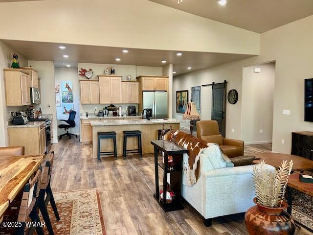 3180 N Eagles Creek Dr, Show Low, AZ 85901 - living room with vaulted ceiling, light wood-type flooring, and recessed lighting