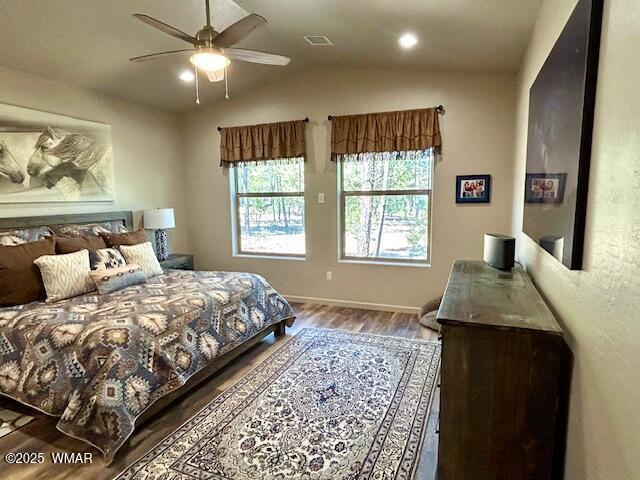 3180 N Eagles Creek Dr, Show Low, AZ 85901 - bedroom with wood finished floors, vaulted ceiling, and ceiling fan