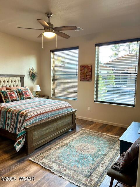 3180 N Eagles Creek Dr, Show Low, AZ 85901 - bedroom featuring wood finished floors and a ceiling fan