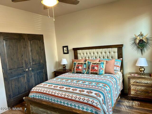 3180 N Eagles Creek Dr, Show Low, AZ 85901 - bedroom featuring wood finished floors and ceiling fan