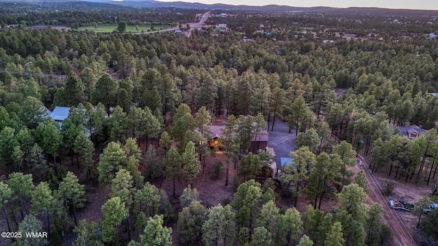 7125 Elk Trl, Show Low, AZ 85901 - aerial overview of property's location featuring a heavily wooded area and a mountainous background