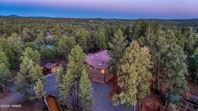 7125 Elk Trl, Show Low, AZ 85901 - aerial view of property and surrounding area featuring a heavily wooded area