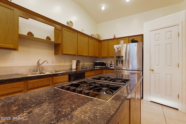 7125 Elk Trl, Show Low, AZ 85901 - kitchen with black gas stovetop, a sink, light tile patterned flooring, stainless steel fridge, and brown cabinetry