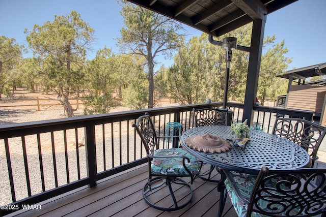 wooden terrace with outdoor dining space