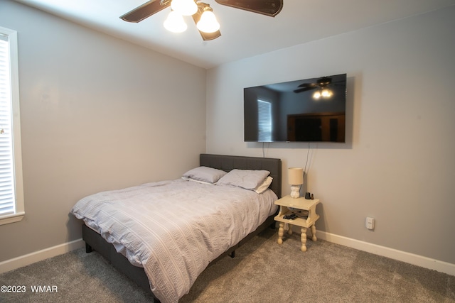 carpeted bedroom with baseboards and a ceiling fan