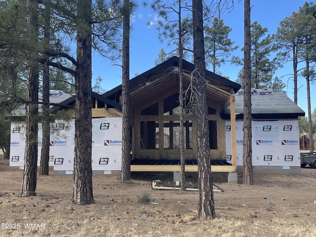 view of side of home featuring crawl space