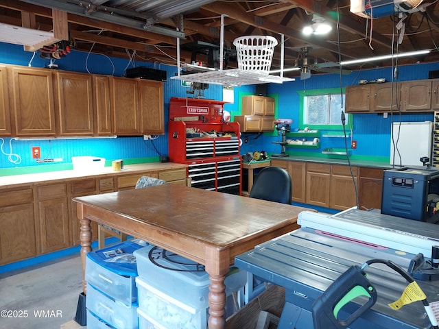 1092 Cedar Dr, Show Low, AZ 85901 - kitchen with concrete floors, light countertops, and brown cabinets