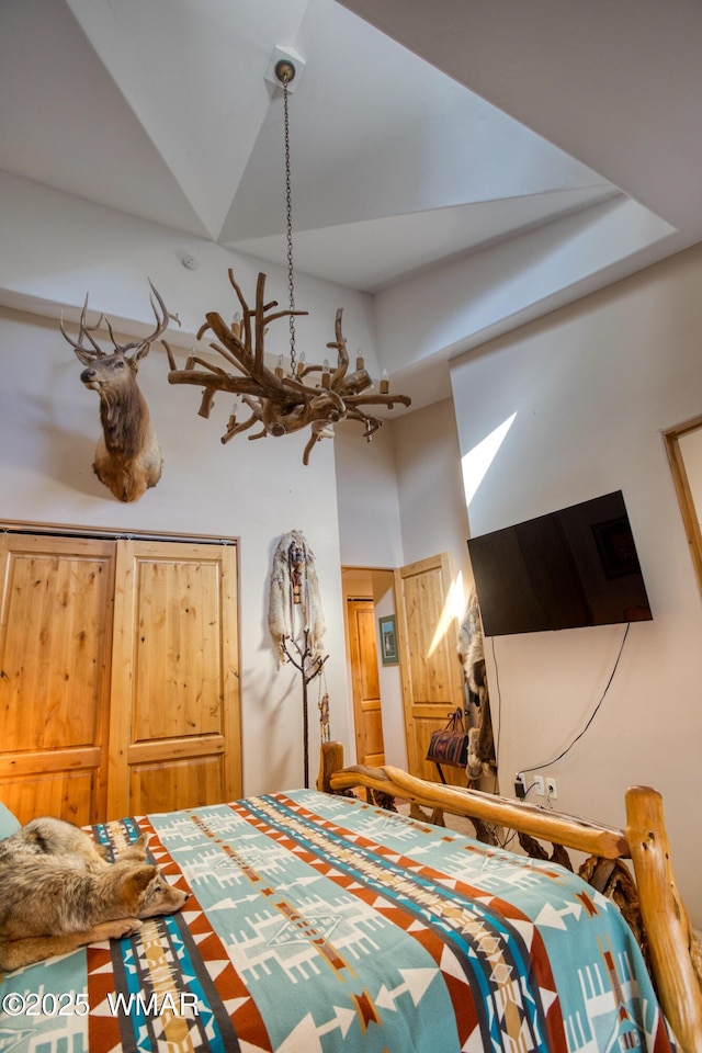 unfurnished bedroom featuring a towering ceiling