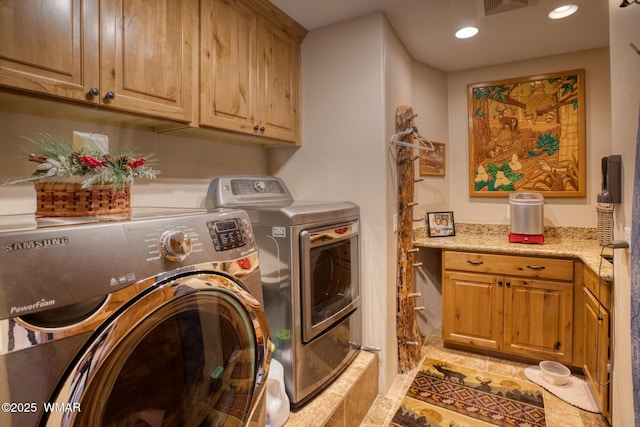 laundry area with recessed lighting, cabinet space, visible vents, and washing machine and clothes dryer