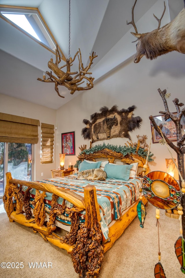 carpeted bedroom featuring lofted ceiling and access to outside