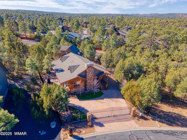 bird's eye view featuring a wooded view