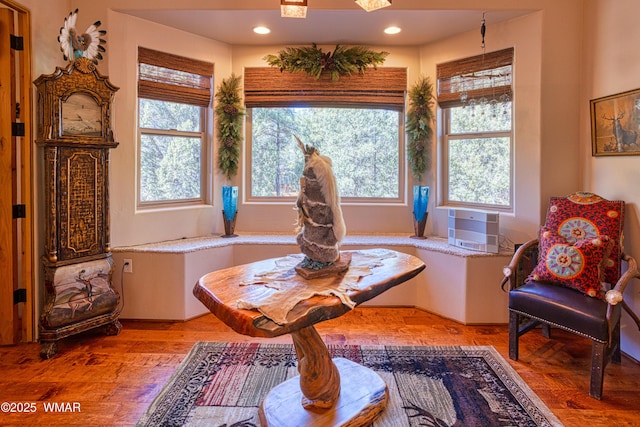 living area with recessed lighting and light wood-style floors