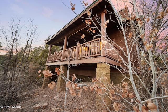 back of property with a wooden deck