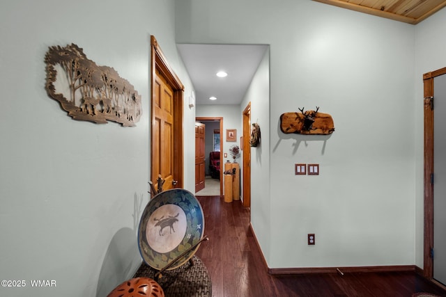 hallway with recessed lighting, dark wood finished floors, and baseboards