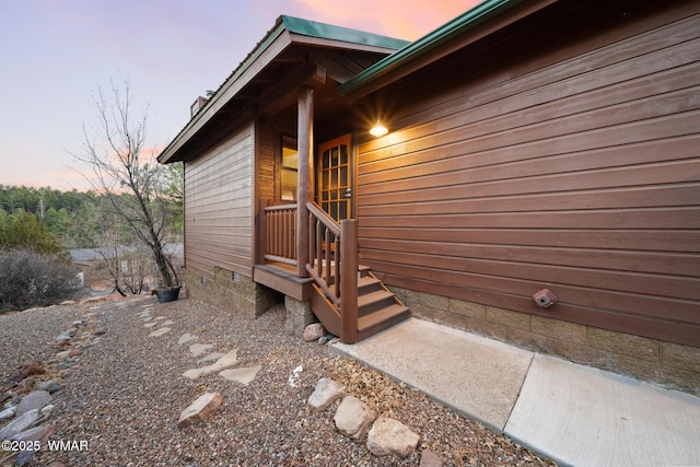 view of exterior entry with crawl space