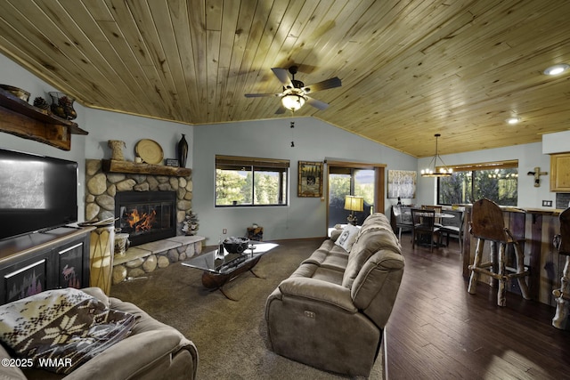 living area featuring dark wood-style floors, lofted ceiling, wood ceiling, a stone fireplace, and ceiling fan with notable chandelier