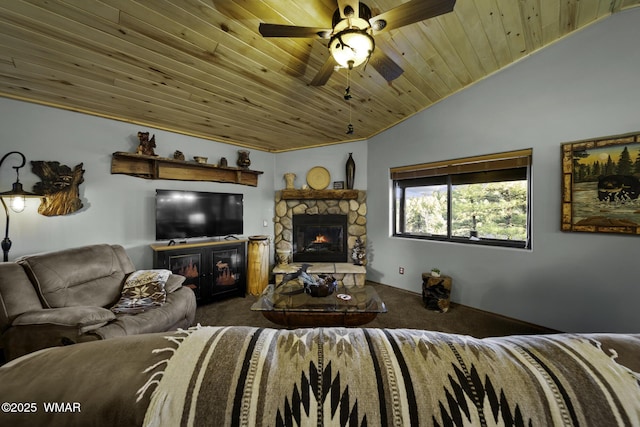 carpeted living room featuring lofted ceiling, ceiling fan, a stone fireplace, and wood ceiling