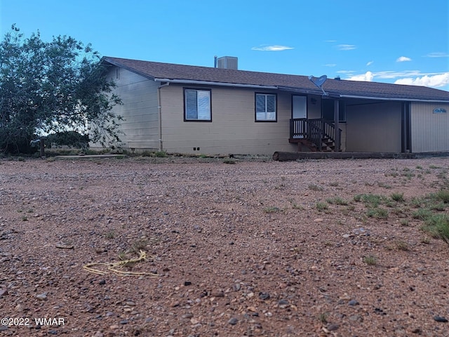 rear view of house with crawl space