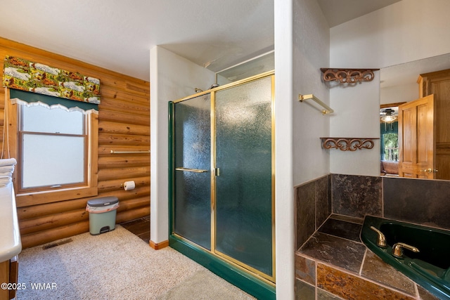 2 Acr 1027, Greer, AZ 85927 - full bath featuring rustic walls, a shower stall, plenty of natural light, and a bath
