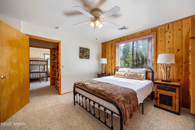 2 Acr 1027, Greer, AZ 85927 - carpeted bedroom with wooden walls, a ceiling fan, and baseboards