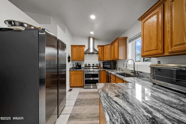 323 N Woodland Rd, Lakeside, AZ 85929 - kitchen with stainless steel appliances, wall chimney range hood, a sink, brown cabinetry, and lofted ceiling