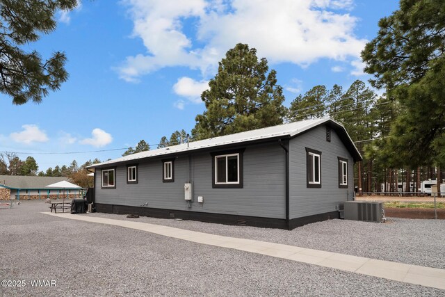 323 N Woodland Rd, Lakeside, AZ 85929 - view of home's exterior with central AC unit and crawl space