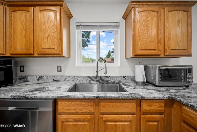 323 N Woodland Rd, Lakeside, AZ 85929 - kitchen with dishwasher, a sink, light stone counters, and brown cabinetry