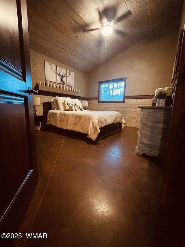 4971 Buck Springs Rd, Pinetop, AZ 85935 - unfurnished bedroom with a ceiling fan, a wainscoted wall, lofted ceiling, finished concrete floors, and wood ceiling