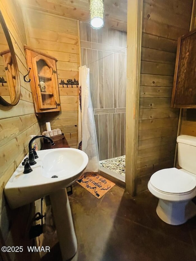 4971 Buck Springs Rd, Pinetop, AZ 85935 - bathroom with toilet, wood walls, and a shower stall