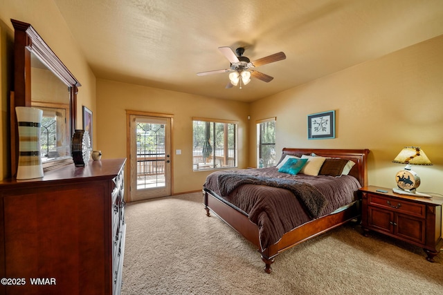 2011 N Lake Breeze Rd, Lakeside, AZ 85929 - bedroom with light carpet, access to outside, a ceiling fan, and baseboards