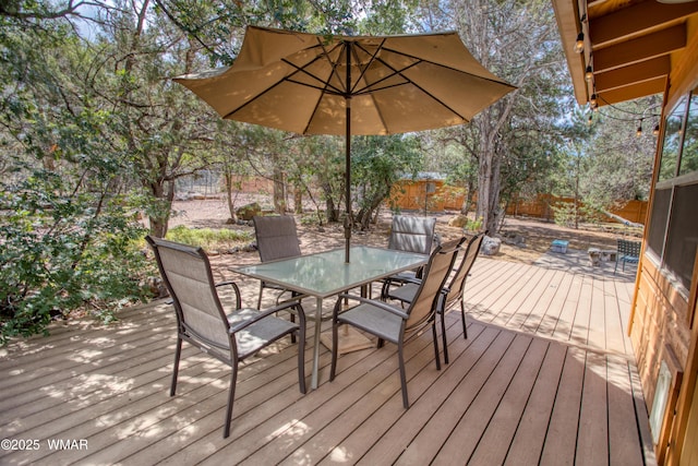 5029 Show Low Lake Rd, Show Low, AZ 85901 - wooden terrace featuring outdoor dining space and a fenced backyard