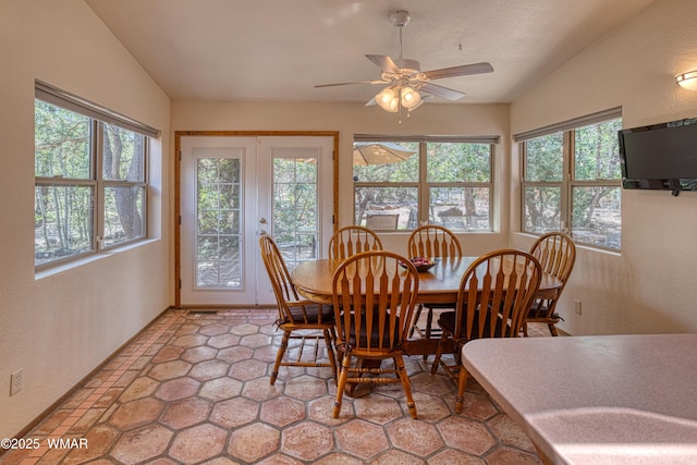5029 Show Low Lake Rd, Show Low, AZ 85901 - dining space featuring healthy amount of natural light, ceiling fan, a textured wall, and lofted ceiling