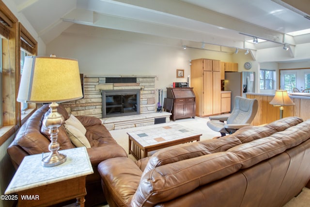 5029 Show Low Lake Rd, Show Low, AZ 85901 - living room featuring track lighting, light colored carpet, and a stone fireplace