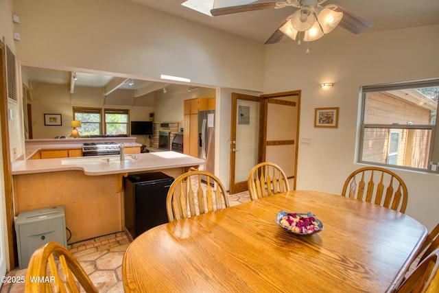 5029 Show Low Lake Rd, Show Low, AZ 85901 - dining space with ceiling fan, a fireplace, and beamed ceiling