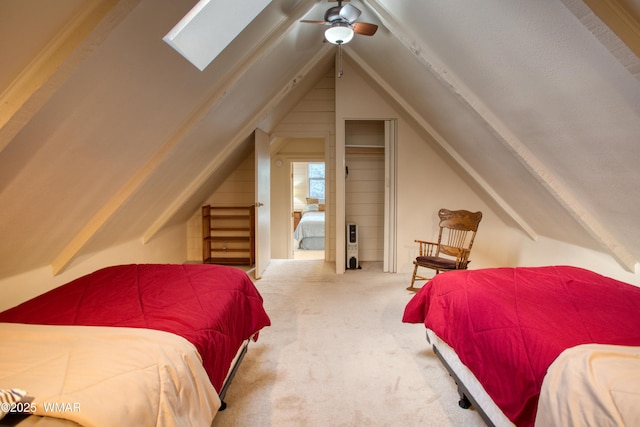 5029 Show Low Lake Rd, Show Low, AZ 85901 - carpeted bedroom with vaulted ceiling, a skylight, and a ceiling fan