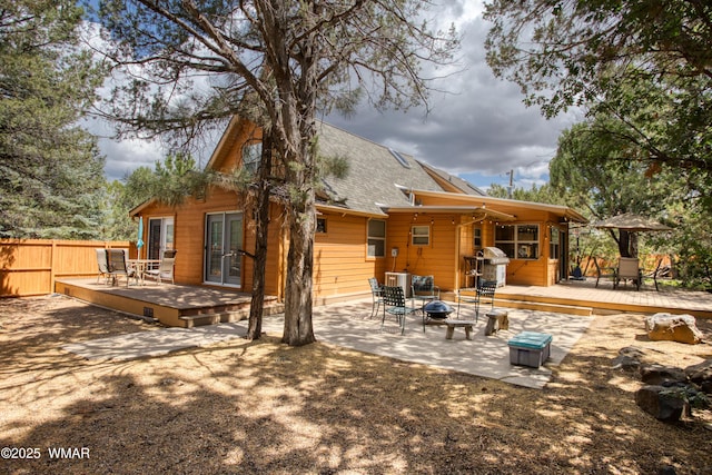 5029 Show Low Lake Rd, Show Low, AZ 85901 - rear view of property with french doors, a fire pit, a deck, and roof with shingles