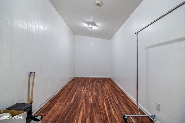 interior space with dark wood-style floors and baseboards